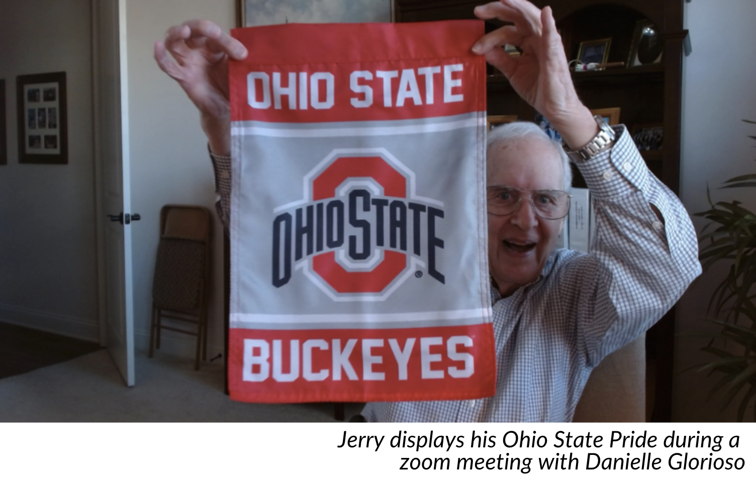 Jerry Stein holding up OSU flag